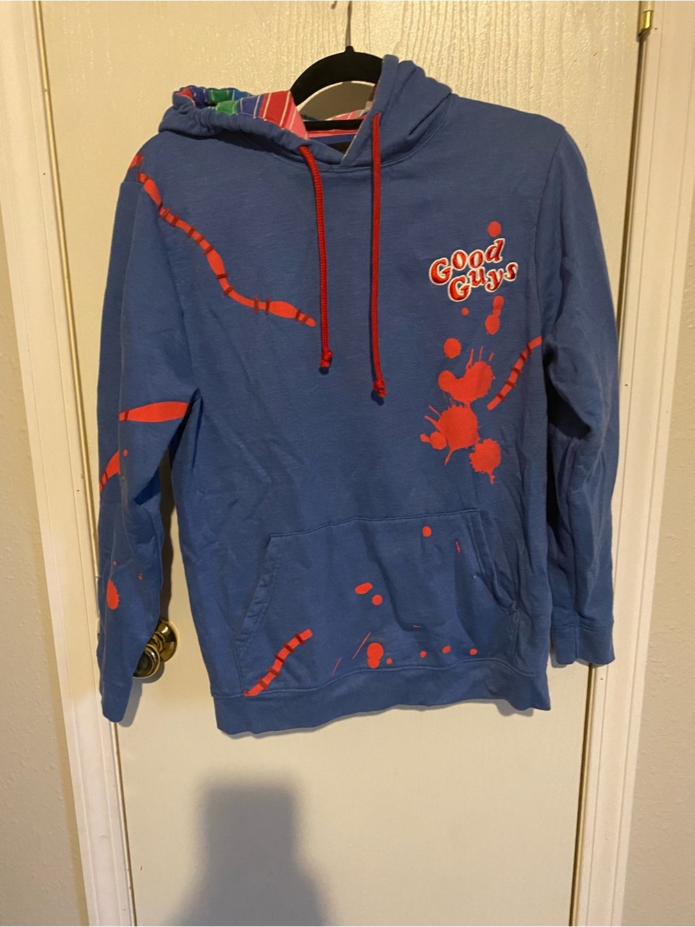 Universal Blue Crewneck Sweater with Red Graphic Accents